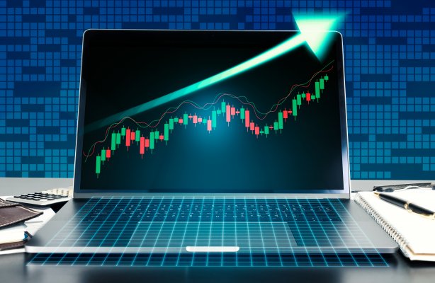 laptop graph stocks going high online stock trading